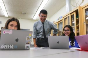 Michael Hoe works with students in EVOBIO