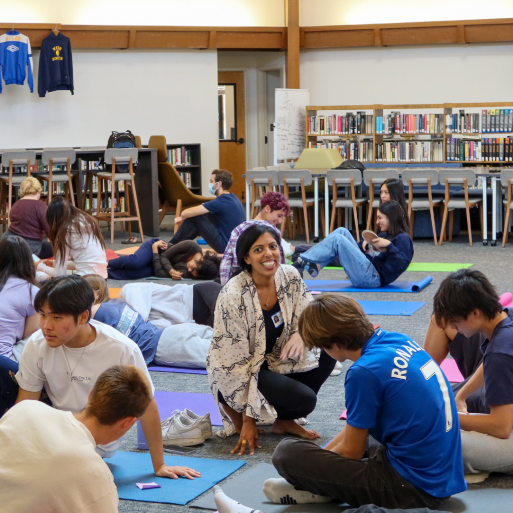 Tejal Patel instructing students at a yoga workshop in Fawcett Library