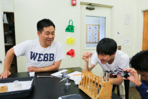 John Choi with students in the classroom