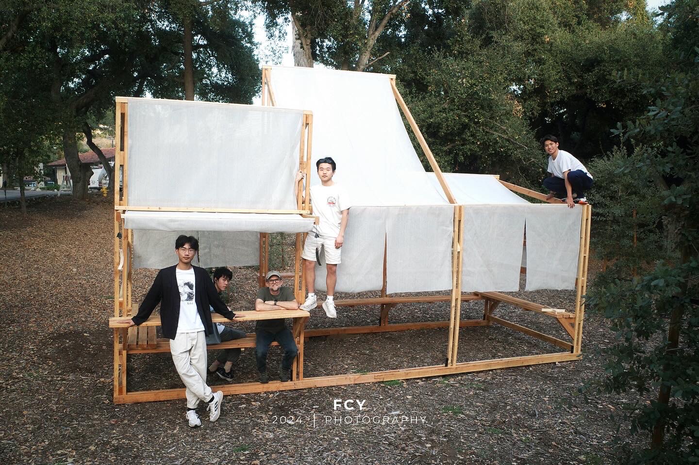 Michael Fu and his team pose with the completed Fabric Pavilion